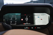© Aerial Film Studio - Close up of a digital instrument cluster shows 0 kmh in Park, trip data, and a 3D map with V16 and Maza iela in Latvia, 8 C at 14 46, odometer 32342 km, and status icons