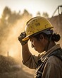 © Normal Desing - Construction worker adjusting safety helmet in dusty environment cinematic closeup sunlit perspective