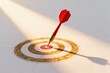 © Worldwide - A dart hitting the center of a target with dramatic lighting.