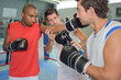 © auremar - a coach training men boxing