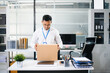 © laddawan - Sad Asian businessman packing box in office after job loss or resignation. Perfect for layoff, career change, unemployment, and business stress concepts.