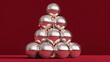 © Nataliia_Trushchenko - Stack of silver balls arranged in a pyramid shape
