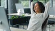 © Yuliia - Relaxing peaceful Hispanic business woman taking break in office businesswoman resting holding hands behind head relax completing working job task in company female dreaming enjoying end of work day