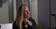 © Marco - Blonde businesswoman clenching jaw in visible frustration during office meeting, overwhelmed and tense as workplace stress reaches breaking point