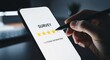 © Graphic EngineerBD - Hand holding stylus completing online survey with star rating on phone