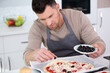 © auremar - man preparing a home made pizza