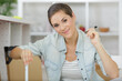 © auremar - woman with self assembly furniture in kitchen