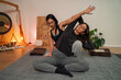 © phoenix021 - Woman performing Thai yoga massage on woman , helping her stretch and energy flow, gong in background