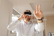 © Parilov - Portrait happy Young caucasian male experiencing virtual reality with headset indoors, office background