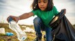© Nataly - Little girl picking up trash from field, a thoughtful scene of environmental stewardship. Picking up trash, girl carefully collects plastic bottles and debris into a black garbage bag.