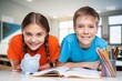 © BillionPhotos.com - Smiling children sitting in class room studying