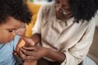 © Jelena - Doctor giving healthcare advice to family