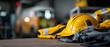 © Fernando - Firefighter protective gear including yellow helmet, jacket, and gloves on a wooden surface in fire station Concept of safety, emergency response, and occupation