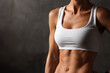 © Vivid_Vision - Woman in white sports top showing toned abs