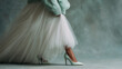 © pijav4uk - Elegant outfit showcases a stylish mint green sweater and tulle skirt