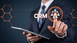 © H - Professional businessman touches digital CRM interface for customer relationship management success