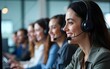 © Daniel - A diverse team of customer service agents wearing headsets works in a modern call center. Professional operators provide technical support and assistance to clients day and night. High quality