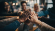 © The Pixel Store - Diverse group of people stacking hands together in a meeting for teamwork and unity