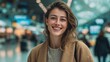 © Tanu - Young woman smiles brightly at an airport terminal while travelers move in the background during daytime