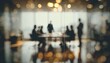 © Audrey - Defocused board meeting background behind glass wall. High quality
