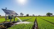 © Tikka MS - Solar-powered irrigation system watering crops in a field under a bright blue sky.