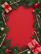 © Magnolia - Christmas Frame. Flat Lay of Fir Branches, Ornaments, and Gifts on a Red Background with Copy Space.