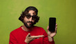 © kues1 - young adult bearded man with a smart phone