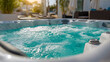 © Daria - Outdoor whirlpool bath with bubbling water and comfortable seating in a modern backyard setting during golden hour sunlight for relaxation and leisure
