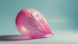 © Muhammad - Pink deflated ballon infront of vibrant sky blue color backdrop