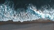 © backup_studio - Aerial top view of ocean wave breaking on dark sand beach. Nature background with sea foam and shoreline for travel and summer concept.