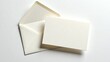 © SarghiArts - An elegant blank ivory notecard and open envelope isolated on a pure white background, perfect for a wedding invitation, holiday greeting, or personalized message mockup