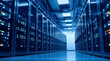 © El Zahra  - wide-angle view of modern data center aisle illuminated with cool lights showing rows of powerful computer servers