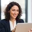 © ART.LAB.IA - Business woman using tablet smiling in office professional look