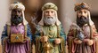 © Running opossum - three wise men figurines with gifts in colorful robes during christmas celebration