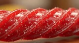 Close-up of a Red Licorice Twist with Sugar Crystals.