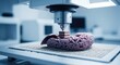 © rahayu - Futuristic bioprinting machine assembling a complex cellular structure on an artificial human brain model in a sterile laboratory setting