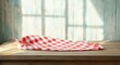 © zong - Sunlit wooden table with a red and white checkered cloth, weathered blue plank wall and soft window shadows evoking a cozy, nostalgic country kitchen mood