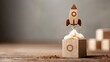 © Dao - Rocket launching from wood cube with business icon, Start-up, Creativity, Big idea, Business goals management, Investment on new project to wealth, Company strategy target, Sustainable financial plan