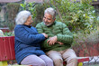 © GAJENDRRA BHATI  - Happy indian senior couple sitting together outdoor in winter season wearing wearing warm clothes talking to each other. Retirement lifestyle. Elderly husband wife bonding.