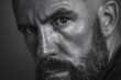 © Studicon - Intense portrait of a bald man with a beard gazing directly at the viewer with a serious expression