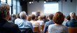 © perfectlab - Audience attending a seminar or conference in a modern meeting room with a speaker presenting in front of a projection screen