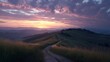 © aimodels24 - Sunrise illuminating a gentle hill in the Italian countryside with a winding path leading to a golden horizon and soft clouds