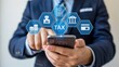 © MediaStockAI - Business professional interacts with digital financial management icons displayed above a smartphone