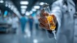 © Istamar - Doctor holds syringe filled with glowing liquid in a sterile hospital environment, blurred background