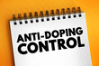 © dizain - Anti-Doping Control - is one tool that Anti-Doping Organizations use to level the playing field and protect clean sport, text concept on notepad