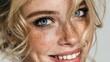 © LimeSky - Blonde woman with blue eyes and flawless skin smiling and sporting freckles