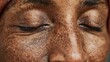 © LimeSky - Zoomed in image of a woman s face with eyes closed emphasizing the skin s wrinkles and textures near her eyes and nose