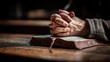 © LimeSky - Man praying with a Bible in the morning hands clasped in church reflecting faith and spirituality