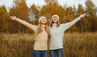 © rohappy - Happy young women friends having fun in autumn park, girlfriends together outdoors