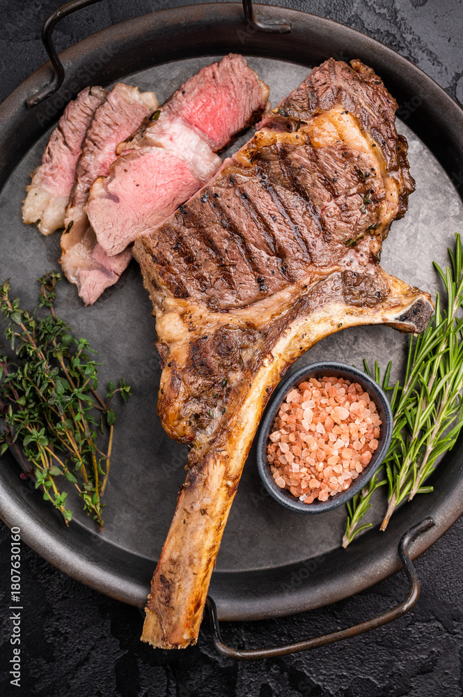 Roasted Tomahawk beef steak, roast dry aged rib eye with bone. black ...